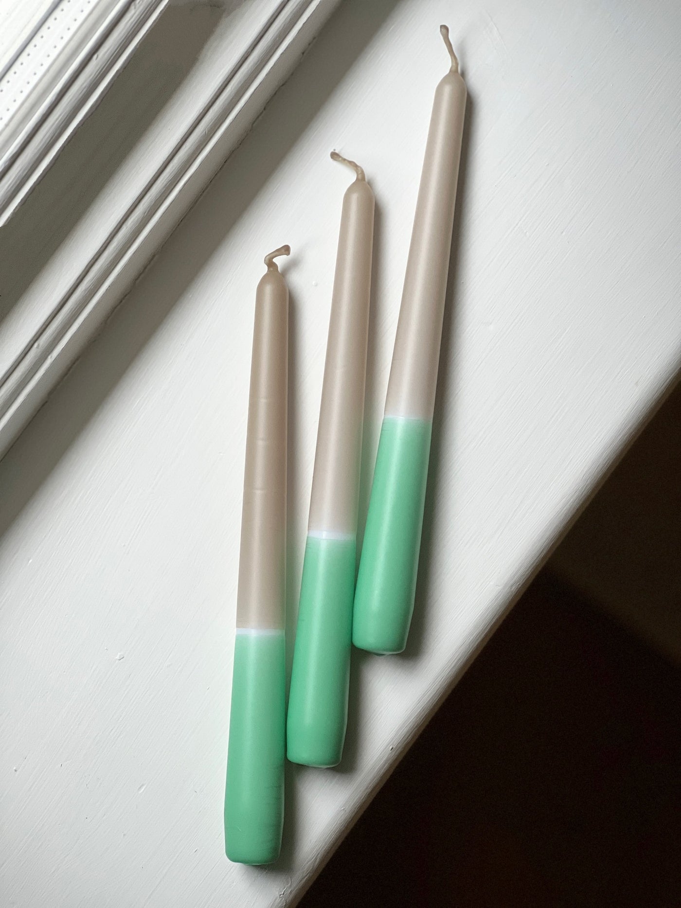 Pastel green dip dye tapered candle trio. Made in England by Loriest & Co. Perfect for every room and any style.