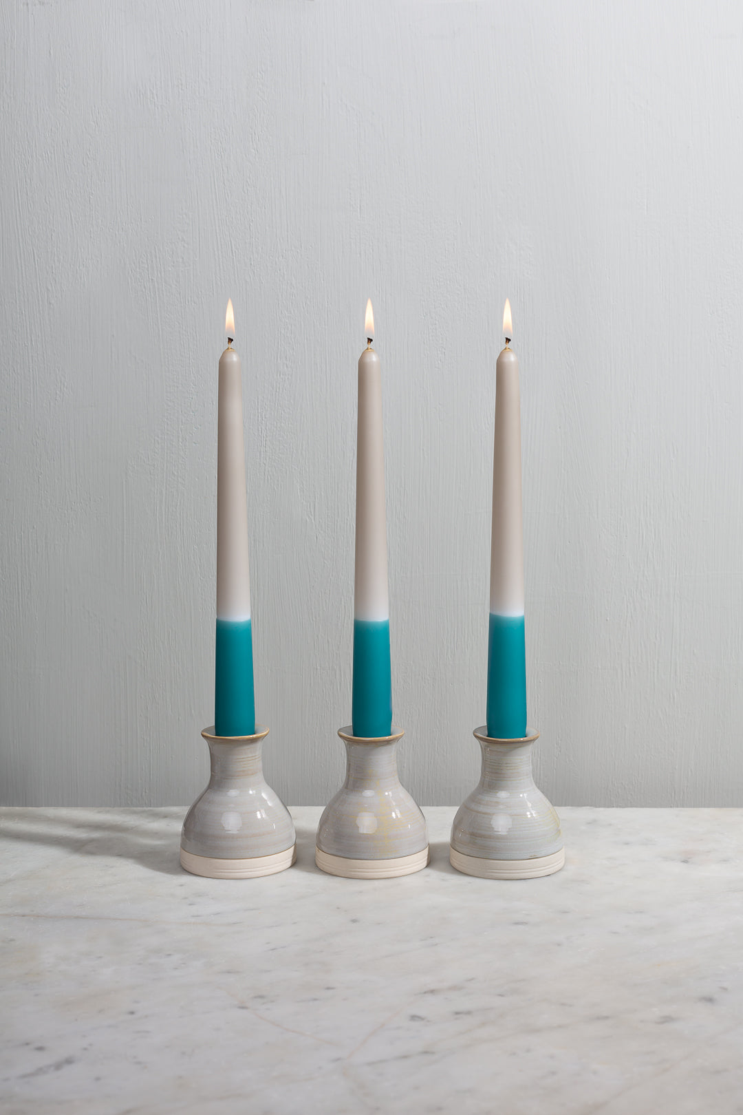 Teal tapered dinner candles. Dip dyed by hand. Made in England. 100% vegan wax.
