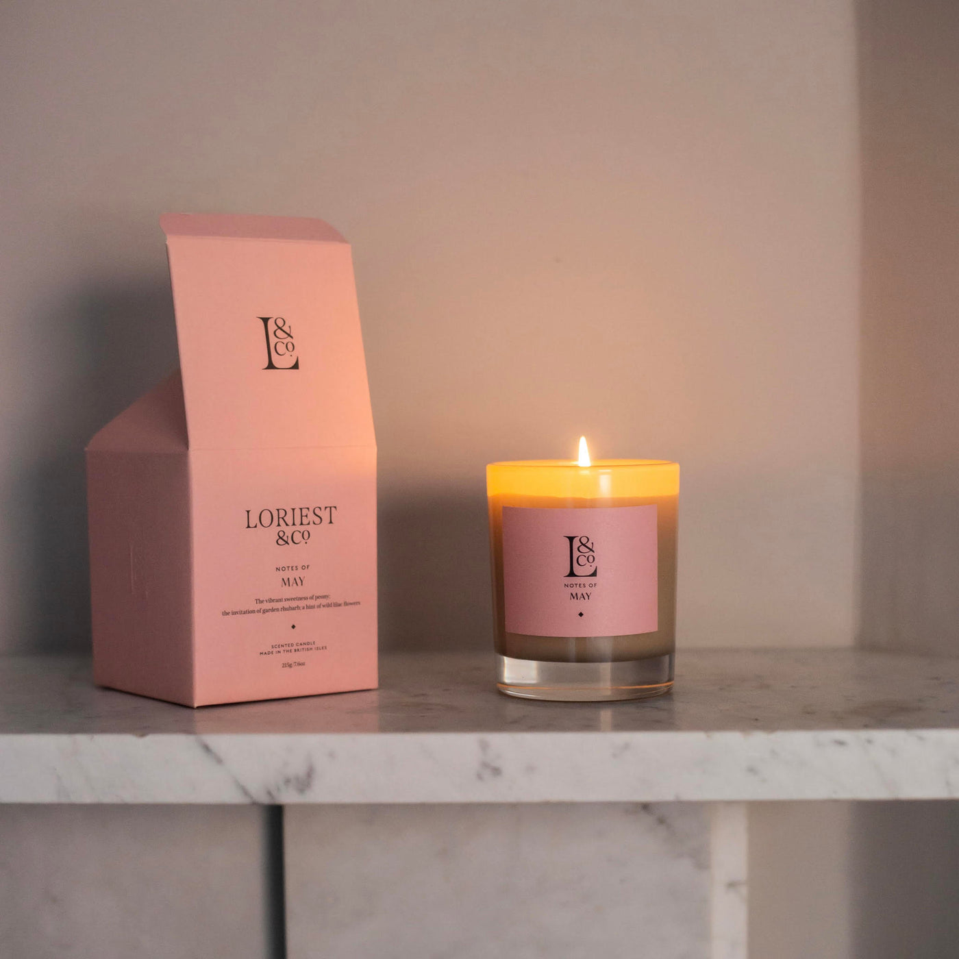 Loriest luxury scented candle Notes of May brings the scent of an early summer garden into your home. Notes of peony, lilac and rhubarb are combined with a sustainable plant based wax. Up to 60 hours burn time. Hand-poured in England.